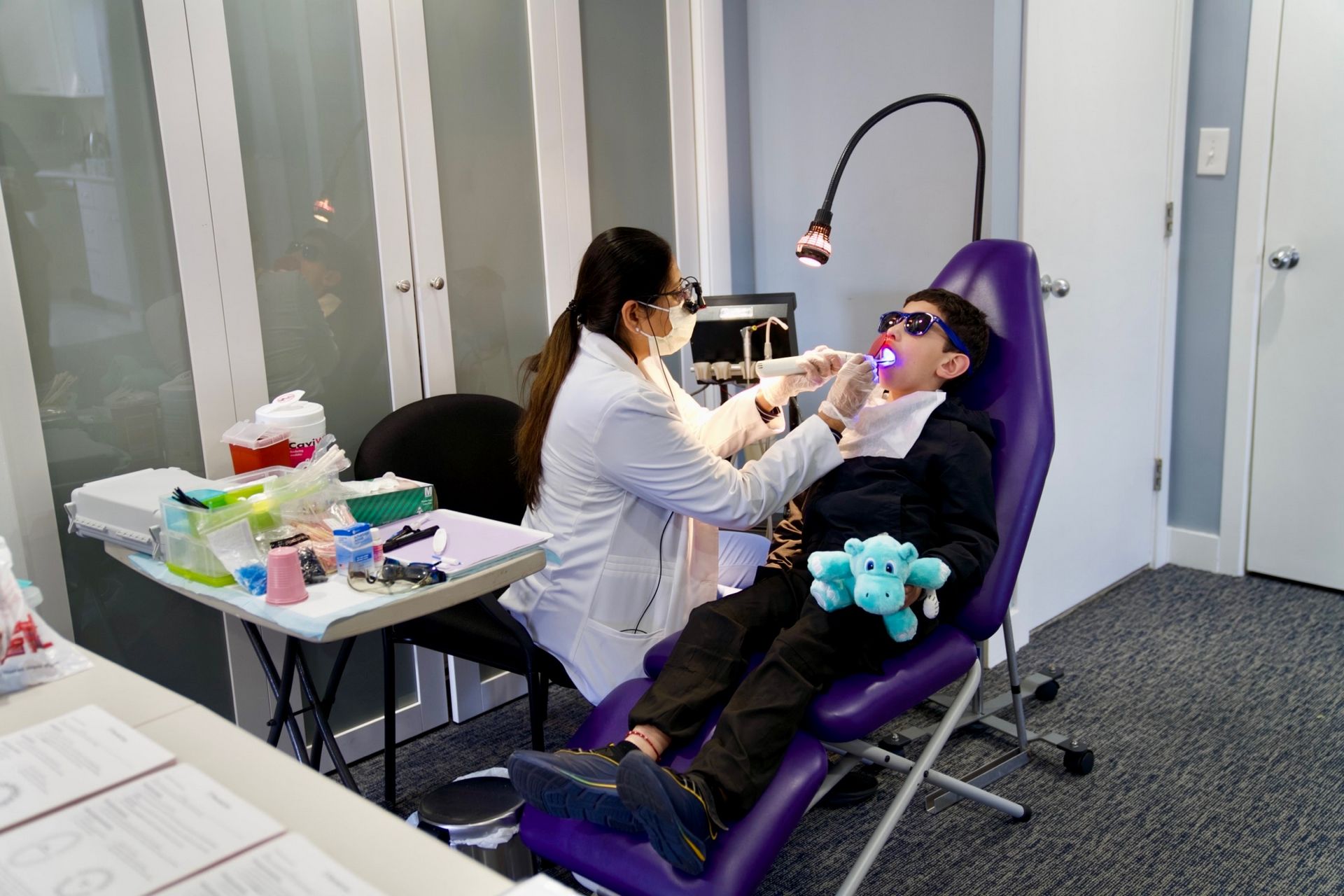 DentaCare team working with students